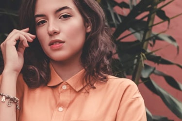 clothing model wearing peach top